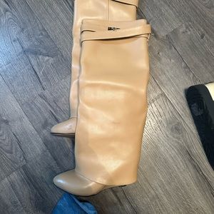 Tan wedge heel women’s boots.